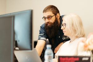 Two Yonder developers discussing ideas while building a prototype during the Hackathon