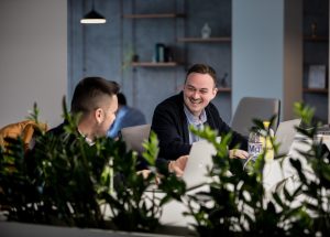 Two Yonder colleagues collaborating on an AI prototype during the Yonder Hackathon